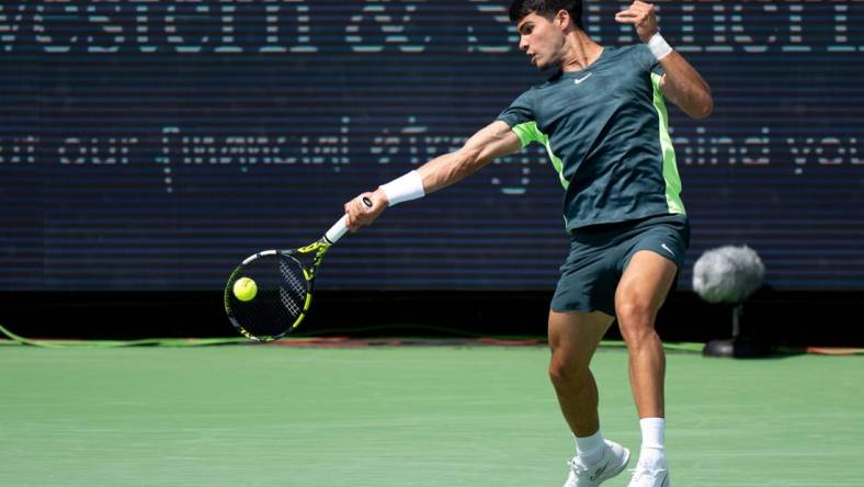 Carlos Alcaraz of Spain, hits a forehand return to Max Purcell of Australia during the quarterfinals of the Western & Southern Open at the Lindner Family Tennis Center in Mason Friday, August, 18, 2023.