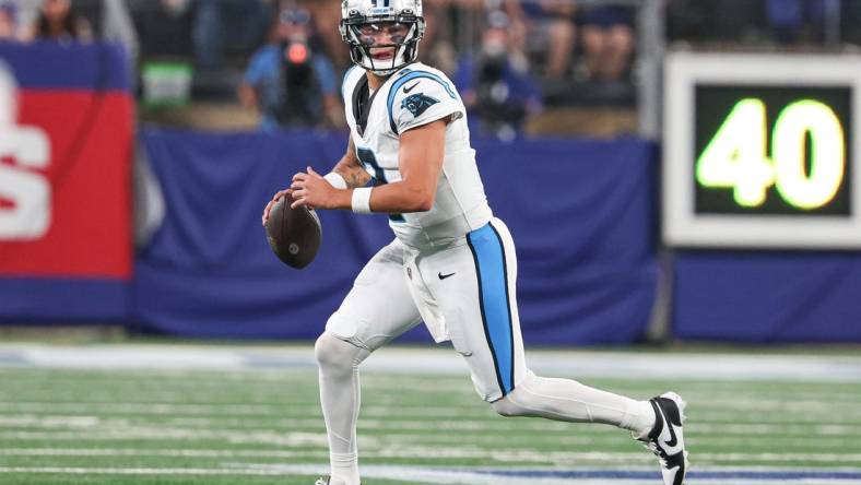 Aug 18, 2023; East Rutherford, New Jersey, USA; Carolina Panthers quarterback Matt Corral (2) scrambles during the second half against the New York Giants at MetLife Stadium. Mandatory Credit: Vincent Carchietta-USA TODAY Sports