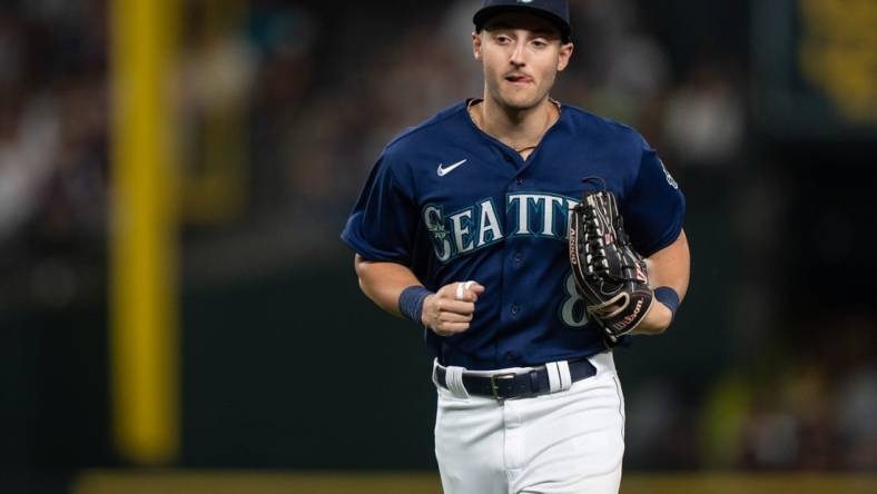 Aug 8, 2023; Seattle, Washington, USA; Seattle Mariners left fielder Dominic Canzone (8) jogs off the field during a game against the San Diego Padres at T-Mobile Park. Mandatory Credit: Stephen Brashear-USA TODAY Sports