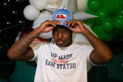 Kamarion Franklin, the No. 1 recruit in Mississippi, puts on an Ole Miss hat as he announces his commitment to Ole Miss football while wearing a shirt that says       Sip Made Kam Stayed    with the Ole Miss logo at Lake Cormorant High School in Lake Cormorant, Miss, on Saturday, August 19, 2023.