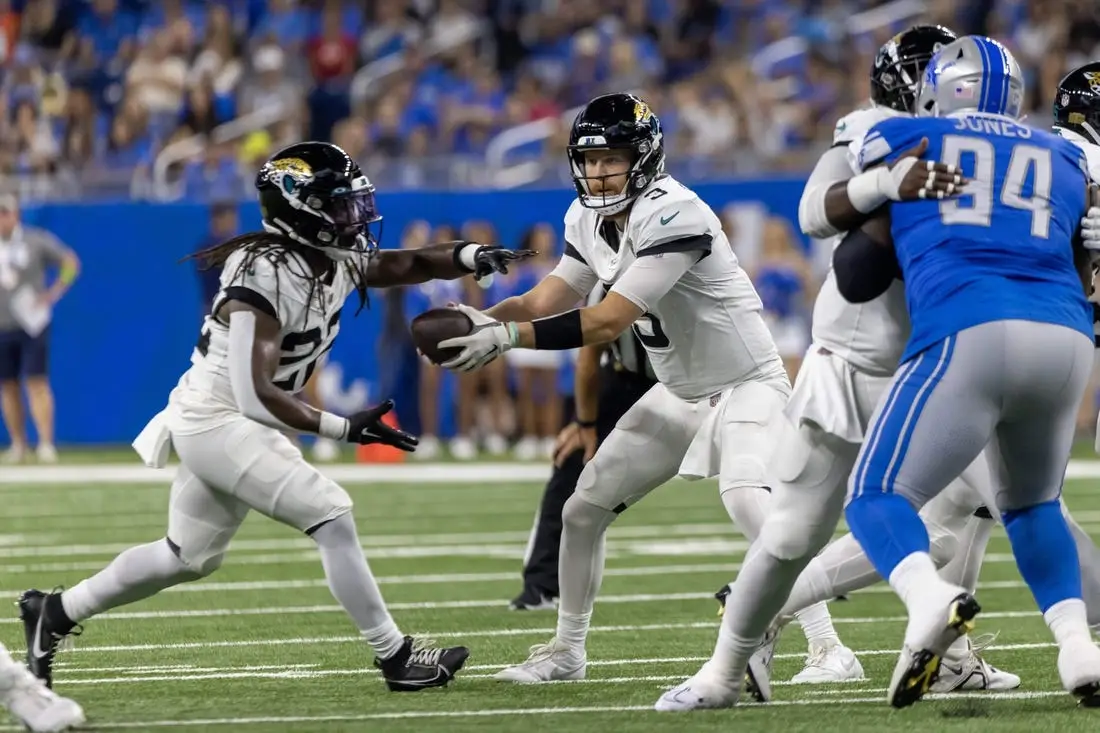 Jacksonville Jaguars running back D'Ernest Johnson (25) runs into the end  zone to score a touchdown during the first half of an NFL preseason  football game against the Miami Dolphins, Saturday, Aug.