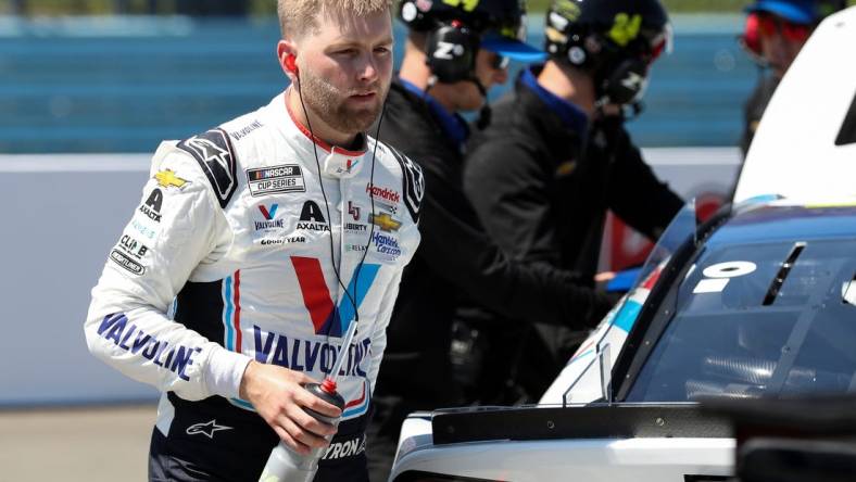 Aug 19, 2023; Watkins Glen, New York, USA; NASCAR Cup Series driver William Byron exits his race car during practice and qualifying for the Go Bowling at The Glen at Watkins Glen International. Mandatory Credit: Matthew O'Haren-USA TODAY Sports