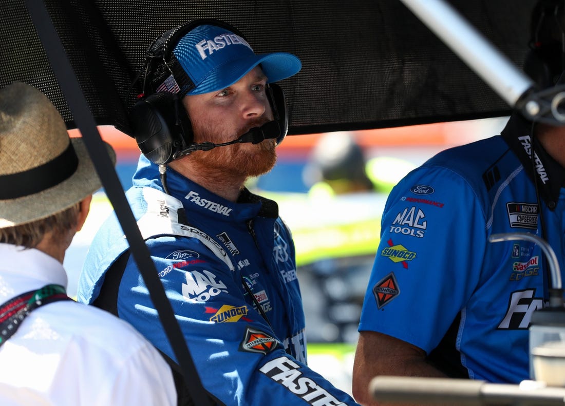 Aug 19, 2023; Watkins Glen, New York, USA; NASCAR Cup Series driver Chris Buescher looks at data during practice and qualifying for the Go Bowling at The Glen at Watkins Glen International. Mandatory Credit: Matthew O'Haren-USA TODAY Sports