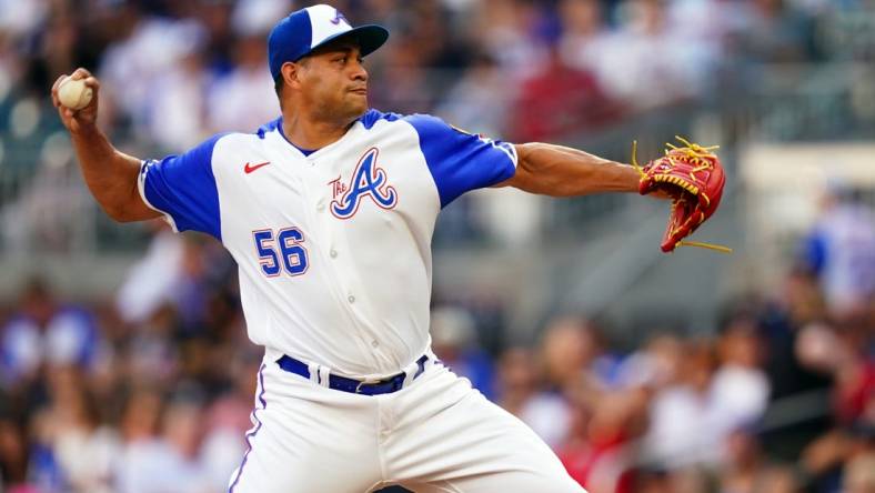 Aug 19, 2023; Cumberland, Georgia, USA; Atlanta Braves relief pitcher Yonny Chirinos (56) cycles through a pitch against the San Francisco Giants during the first inning at Truist Park. Mandatory Credit: John David Mercer-USA TODAY Sports