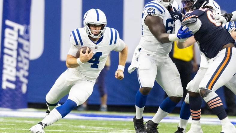 Aug 19, 2023; Indianapolis, Indiana, USA; Indianapolis Colts quarterback Sam Ehlinger (4) runs the ball in the second quarter against the Chicago Bears at Lucas Oil Stadium. Mandatory Credit: Trevor Ruszkowski-USA TODAY Sports