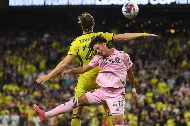Aug 19, 2023; Nashville, TN, USA; Inter Miami midfielder David Ruiz (41) and Nashville SC defender Walker Zimmerman (25) head the ball during the second half for the Leagues Cup Championship match at GEODIS Park. Mandatory Credit: Christopher Hanewinckel-USA TODAY Sports