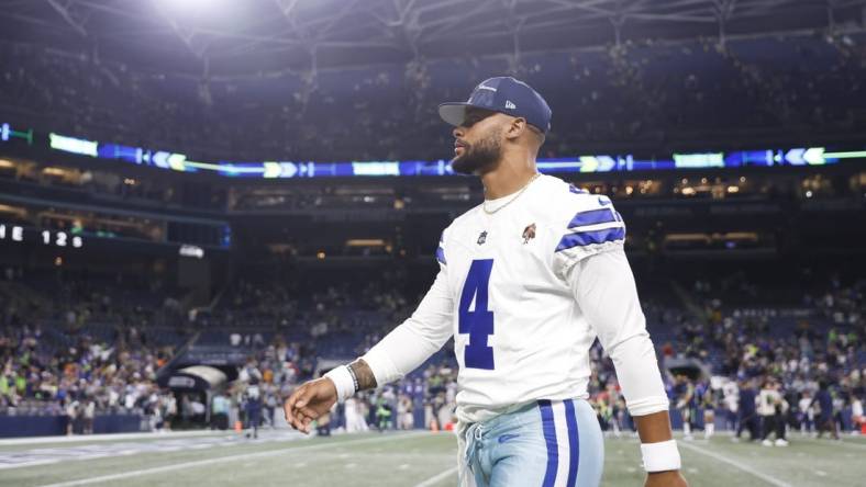 Aug 19, 2023; Seattle, Washington, USA; Dallas Cowboys quarterback Dak Prescott (4) walks to the locker room following a 22-14 Seattle victory at Lumen Field. Mandatory Credit: Joe Nicholson-USA TODAY Sports