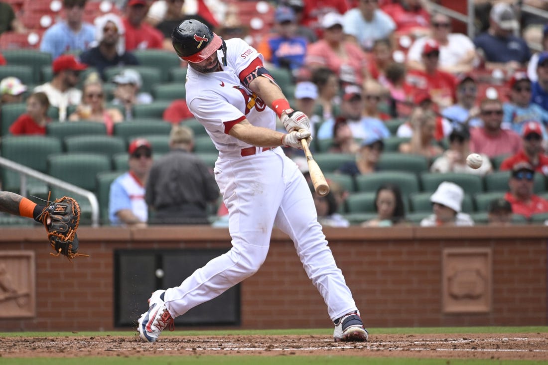 Aug 20, 2023; St. Louis, Missouri, USA; St. Louis Cardinals first baseman Paul Goldschmidt (46) hits an RBI single against the New York Mets in the third inning at Busch Stadium. Mandatory Credit: Joe Puetz-USA TODAY Sports