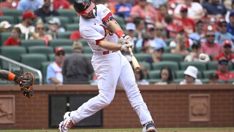 Aug 20, 2023; St. Louis, Missouri, USA; St. Louis Cardinals first baseman Paul Goldschmidt (46) hits an RBI single against the New York Mets in the third inning at Busch Stadium. Mandatory Credit: Joe Puetz-USA TODAY Sports