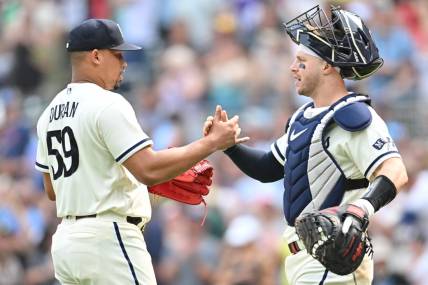 Aug 20, 2023; Minneapolis, Minnesota, USA; Minnesota Twins relief pitcher Jhoan Duran (59) and catcher Ryan Jeffers (27) react after the game against the Pittsburgh Pirates at Target Field. Mandatory Credit: Jeffrey Becker-USA TODAY Sports