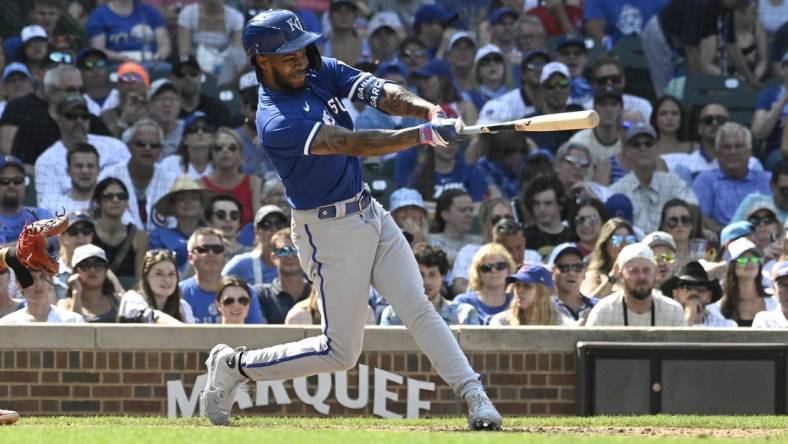 Aug 20, 2023; Chicago, Illinois, USA;  Kansas City Royals third baseman Maikel Garcia (11) hits an RBI single against the Chicago Cubs during the ninth inning at Wrigley Field. Mandatory Credit: Matt Marton-USA TODAY Sports