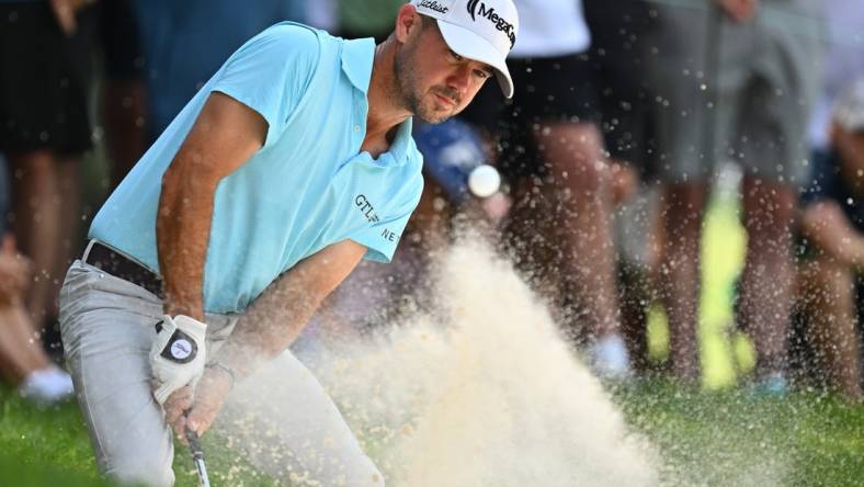 Aug 20, 2023; Olympia Fields, Illinois, USA; Brian Harman hits out of a bunker on the 2nd green during the final round of the BMW Championship golf tournament. Mandatory Credit: Jamie Sabau-USA TODAY Sports