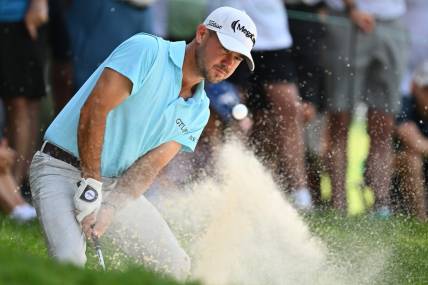 Aug 20, 2023; Olympia Fields, Illinois, USA; Brian Harman hits out of a bunker on the 2nd green during the final round of the BMW Championship golf tournament. Mandatory Credit: Jamie Sabau-USA TODAY Sports