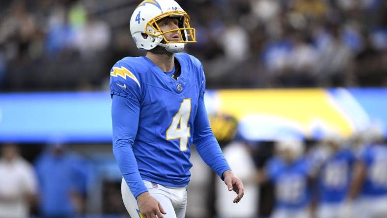 Aug 20, 2023; Inglewood, California, USA; Los Angeles Chargers place kicker Dustin Hopkins (4) prepares to kick a field goal against the New Orleans Saints during the first half at SoFi Stadium. Mandatory Credit: Orlando Ramirez-USA TODAY Sports