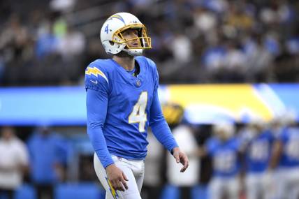 Aug 20, 2023; Inglewood, California, USA; Los Angeles Chargers place kicker Dustin Hopkins (4) prepares to kick a field goal against the New Orleans Saints during the first half at SoFi Stadium. Mandatory Credit: Orlando Ramirez-USA TODAY Sports