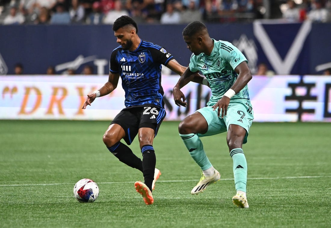 Aug 20, 2023; Vancouver, British Columbia, CAN; Vancouver Whitecaps FC forward Sergio Cordova (9) defends against San Jose Earthquakes defender Rodrigues (26) during first half at BC Place. Mandatory Credit: Simon Fearn-USA TODAY Sports