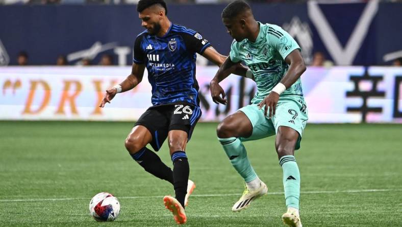 Aug 20, 2023; Vancouver, British Columbia, CAN; Vancouver Whitecaps FC forward Sergio Cordova (9) defends against San Jose Earthquakes defender Rodrigues (26) during first half at BC Place. Mandatory Credit: Simon Fearn-USA TODAY Sports