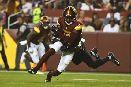 Aug 21, 2023; Landover, Maryland, USA; Washington Commanders wide receiver Terry McLaurin (17) runs after a catch during the first half at FedExField. Mandatory Credit: Brad Mills-USA TODAY Sports