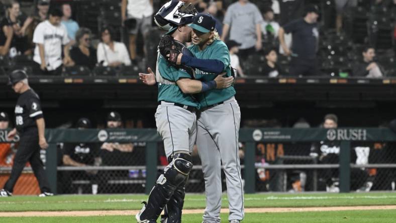 Aug 21, 2023; Chicago, Illinois, USA;  Seattle Mariners catcher Brian O'Keefe (64) and Seattle Mariners relief pitcher Darren McCaughan (26) after the game against the Chicago White Sox at Guaranteed Rate Field. Mandatory Credit: Matt Marton-USA TODAY Sports