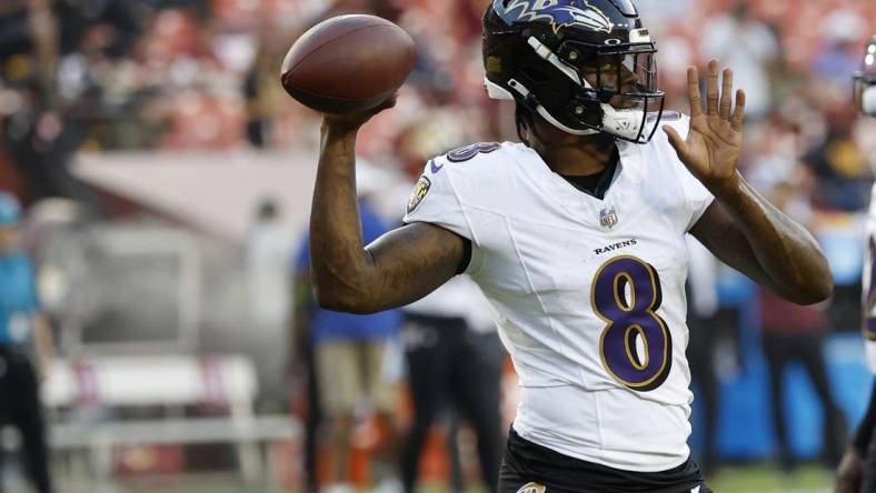 Aug 21, 2023; Landover, Maryland, USA; Baltimore Ravens quarterback Lamar Jackson (8) passes the ball during warmups prior to their game against the Washington Commanders at FedExField. Mandatory Credit: Geoff Burke-USA TODAY Sports