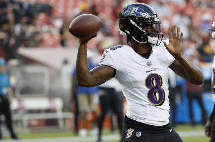 Aug 21, 2023; Landover, Maryland, USA; Baltimore Ravens quarterback Lamar Jackson (8) passes the ball during warmups prior to their game against the Washington Commanders at FedExField. Mandatory Credit: Geoff Burke-USA TODAY Sports