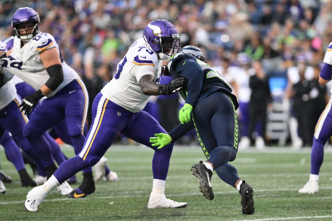 Aug 10, 2023; Seattle, Washington, USA; Minnesota Vikings offensive tackle Vederian Lowe (79) blocks Seattle Seahawks linebacker Tyreke Smith (92) during the game at Lumen Field. Mandatory Credit: Steven Bisig-USA TODAY Sports