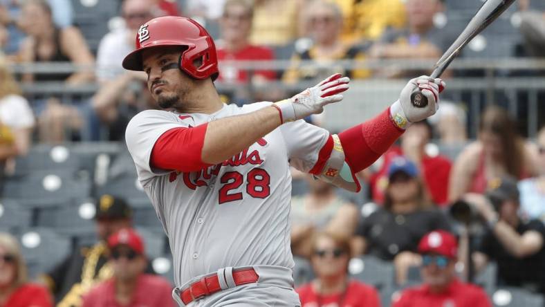 Aug 23, 2023; Pittsburgh, Pennsylvania, USA;  St. Louis Cardinals third baseman Nolan Arenado (28) hits a two run double against the Pittsburgh Pirates during the second inning at PNC Park. Mandatory Credit: Charles LeClaire-USA TODAY Sports