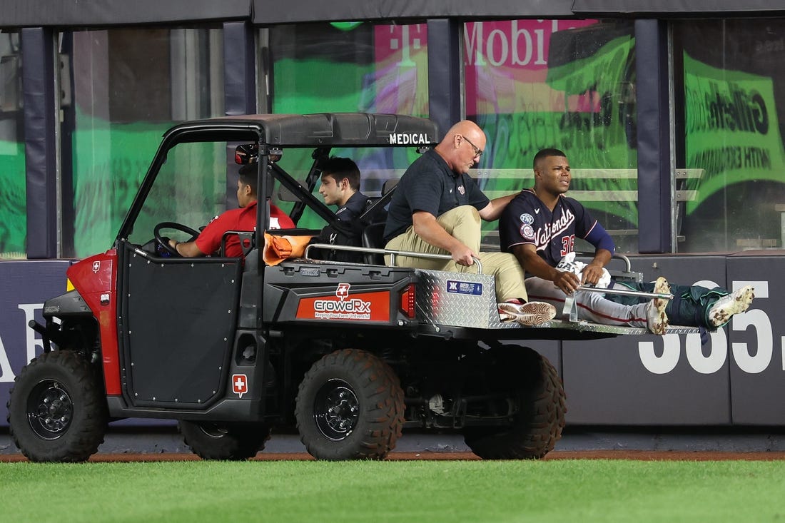 Aug 23, 2023; Bronx, New York, USA; Washington Nationals left fielder Stone Garrett (36) is driven off  the field after an injury during the seventh inning against the New York Yankees at Yankee Stadium. Mandatory Credit: Vincent Carchietta-USA TODAY Sports