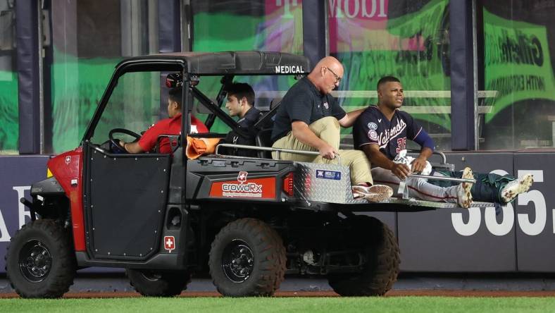 Aug 23, 2023; Bronx, New York, USA; Washington Nationals left fielder Stone Garrett (36) is driven off  the field after an injury during the seventh inning against the New York Yankees at Yankee Stadium. Mandatory Credit: Vincent Carchietta-USA TODAY Sports