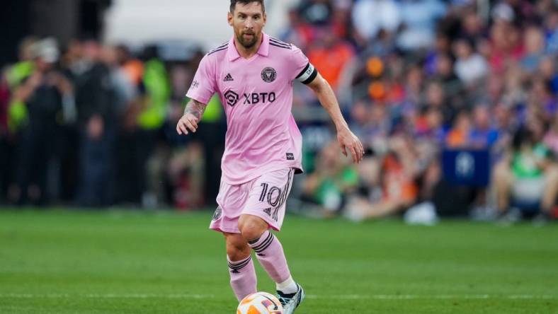 Aug 23, 2023; Cincinnati, OH, USA; Inter Miami CF forward Lionel Messi (10) dribbles the ball against FC Cincinnati during the first half at TQL Stadium. Mandatory Credit: Aaron Doster-USA TODAY Sports