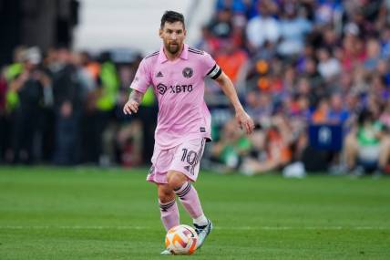 Aug 23, 2023; Cincinnati, OH, USA; Inter Miami CF forward Lionel Messi (10) dribbles the ball against FC Cincinnati during the first half at TQL Stadium. Mandatory Credit: Aaron Doster-USA TODAY Sports