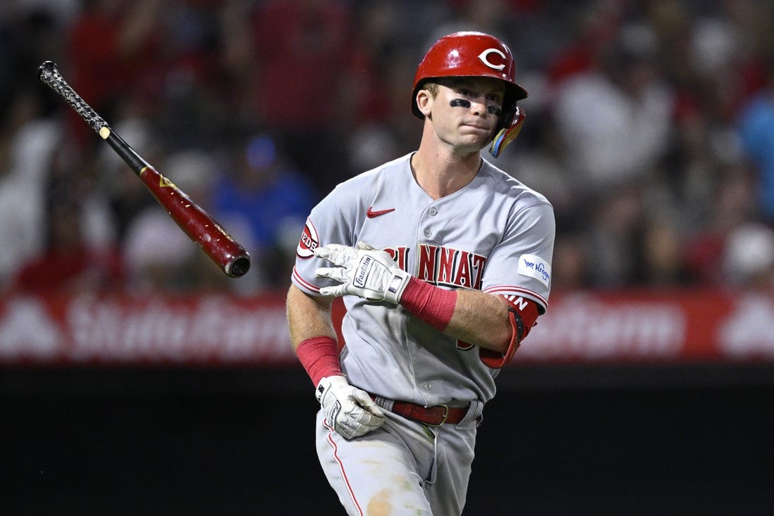 Aug 23, 2023; Anaheim, California, USA; Cincinnati Reds second baseman Matt McLain (9) tosses his bat after hitting a two-run home run against the Los Angeles Angels during the eighth inning at Angel Stadium. Mandatory Credit: Orlando Ramirez-USA TODAY Sports