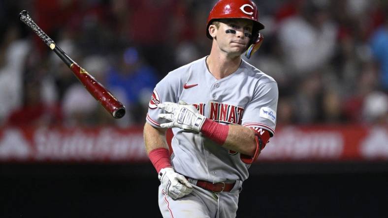 Aug 23, 2023; Anaheim, California, USA; Cincinnati Reds second baseman Matt McLain (9) tosses his bat after hitting a two-run home run against the Los Angeles Angels during the eighth inning at Angel Stadium. Mandatory Credit: Orlando Ramirez-USA TODAY Sports