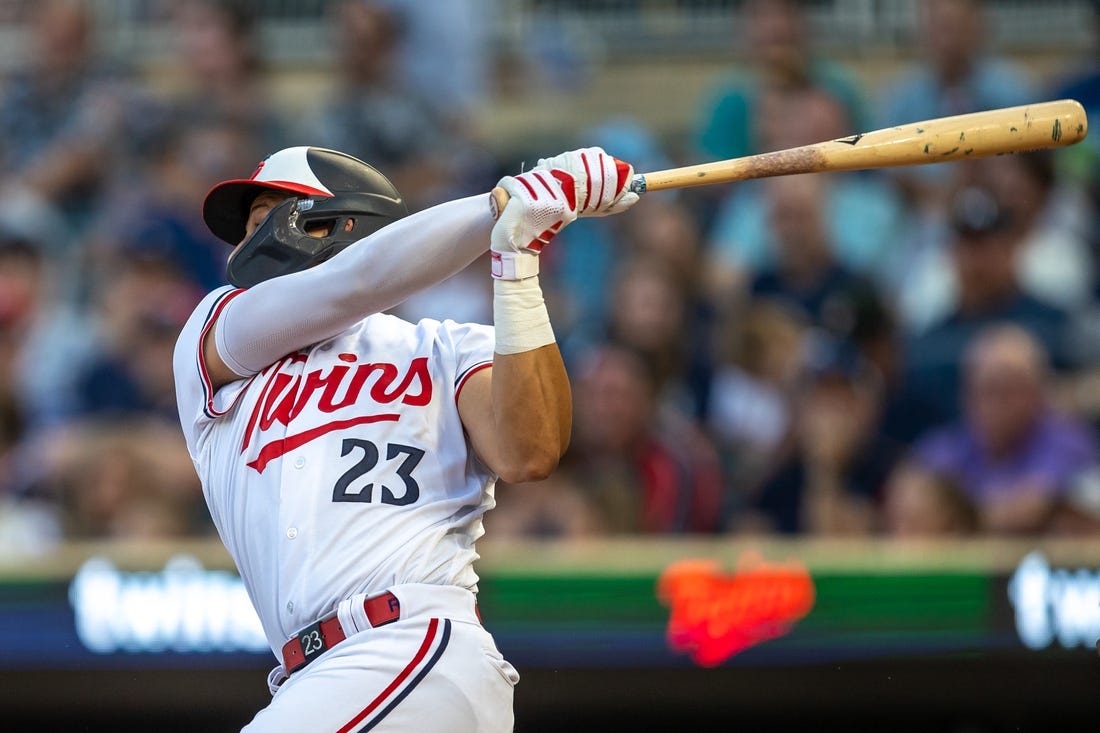 Aug 24, 2023; Minneapolis, Minnesota, USA; Minnesota Twins third baseman Royce Lewis (23) hits a double in the fourth inning against the Texas Rangers in the fourth inning at Target Field. Mandatory Credit: Jesse Johnson-USA TODAY Sports