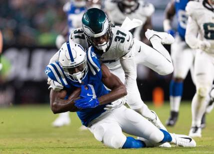 Aug 24, 2023; Philadelphia, Pennsylvania, USA; Philadelphia Eagles cornerback Kelee Ringo (37) tackles Indianapolis Colts wide receiver Breshad Perriman (9) after his catch during the third quarter at Lincoln Financial Field. Mandatory Credit: Bill Streicher-USA TODAY Sports