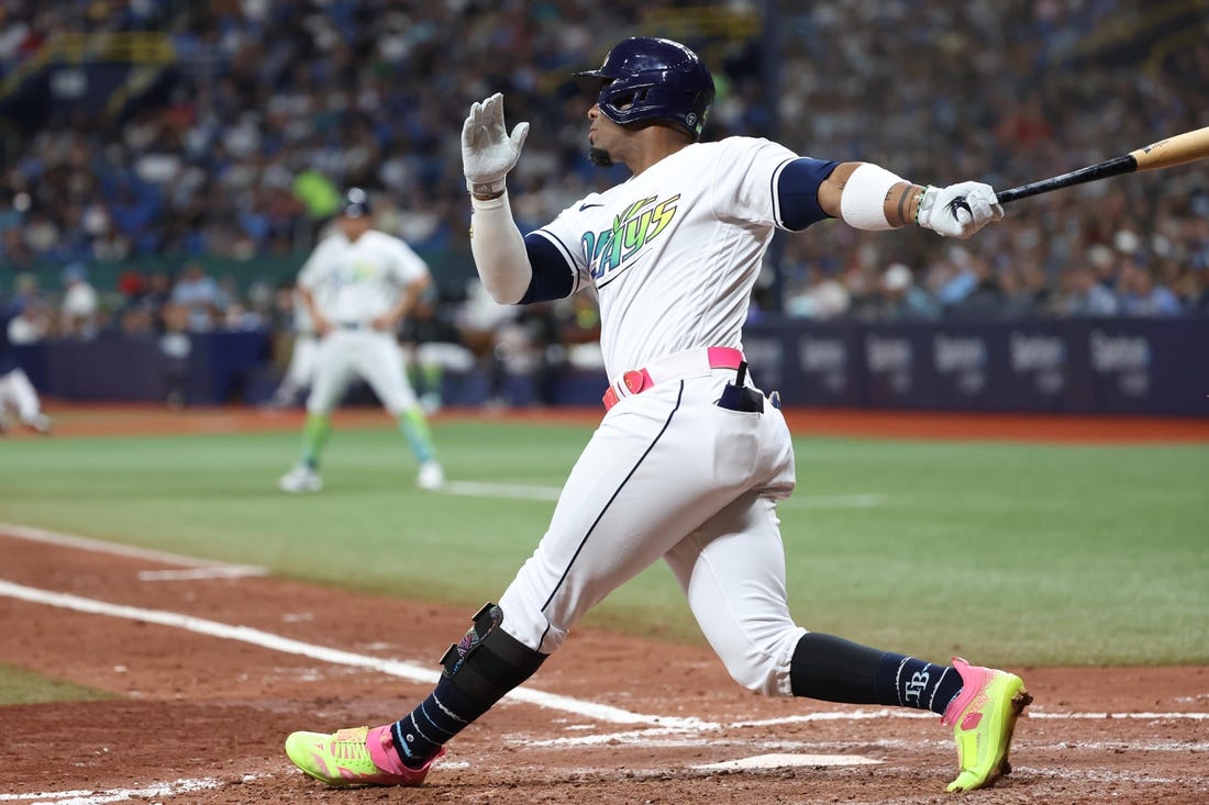 Aug 25, 2023; St. Petersburg, Florida, USA; Tampa Bay Rays first baseman Yandy Diaz (2) hits a home run against the New York Yankees during the sixth inning at Tropicana Field. Mandatory Credit: Kim Klement Neitzel-USA TODAY Sports