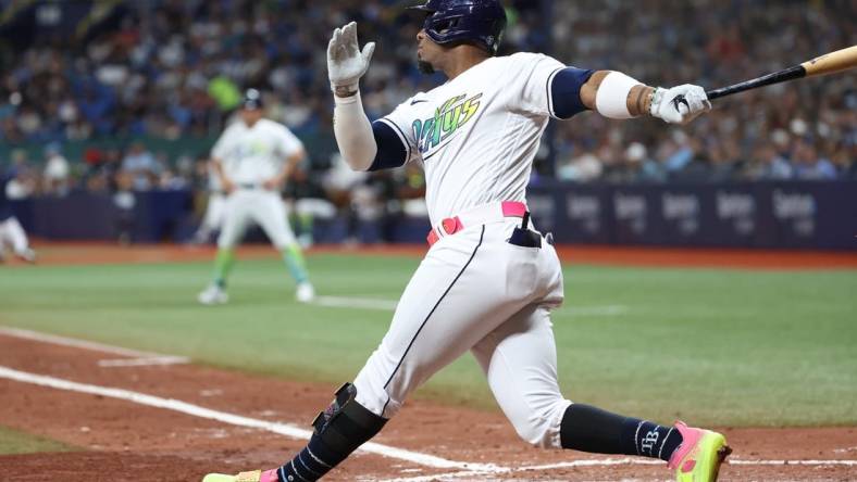 Aug 25, 2023; St. Petersburg, Florida, USA; Tampa Bay Rays first baseman Yandy Diaz (2) hits a home run against the New York Yankees during the sixth inning at Tropicana Field. Mandatory Credit: Kim Klement Neitzel-USA TODAY Sports