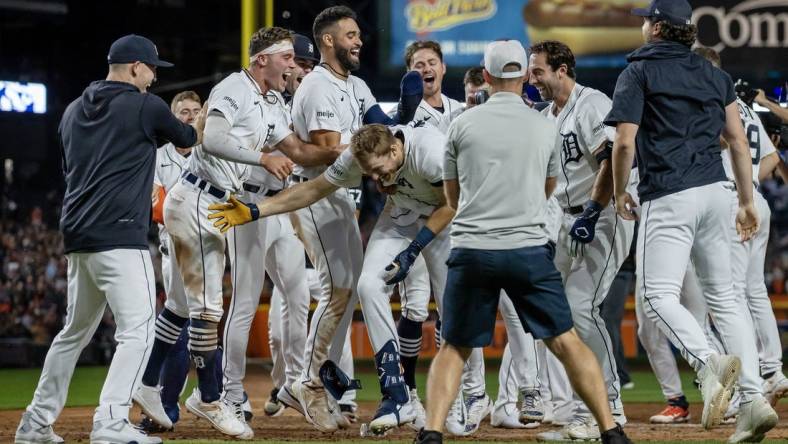 Aug 26, 2023; Detroit, Michigan, USA; Detroit Tigers center fielder Parker Meadows (22) is congratulated after hitting a walk off three run home run in the ninth inning against the Houston Astros at Comerica Park. Mandatory Credit: David Reginek-USA TODAY Sports