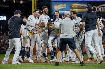 Aug 26, 2023; Detroit, Michigan, USA; Detroit Tigers center fielder Parker Meadows (22) is congratulated after hitting a walk off three run home run in the ninth inning against the Houston Astros at Comerica Park. Mandatory Credit: David Reginek-USA TODAY Sports