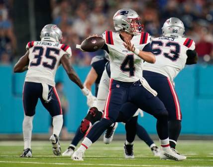New England Patriots quarterback Bailey Zappe (4) throws a pass during the third quarter at Nissan Stadium in Nashville, Tenn., Friday, Aug. 25, 2023.