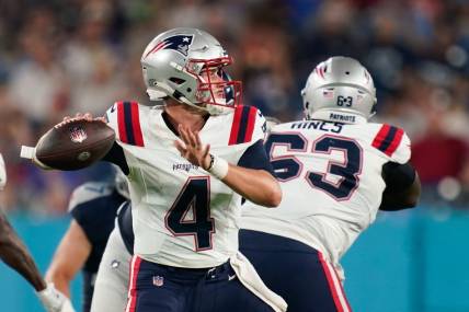 Aug 25, 2023; Nashville, Tennessee, USA; New England Patriots quarterback Bailey Zappe (4) throws a pass during the third quarter against the Tennessee Titans at Nissan Stadium. Mandatory Credit: Andrew Nelles-USA TODAY Sports
