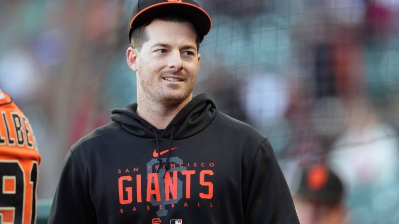 Aug 25, 2023; San Francisco, California, USA; San Francisco Giants outfielder Mike Yastrzemski stands in the dugout before the game against the Atlanta Braves at Oracle Park. Mandatory Credit: Darren Yamashita-USA TODAY Sports