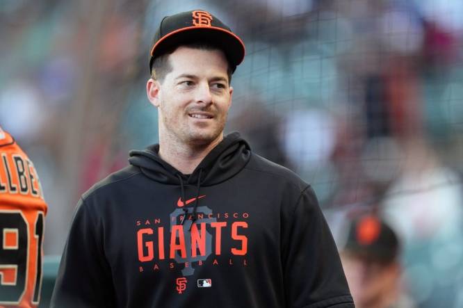 Aug 25, 2023; San Francisco, California, USA; San Francisco Giants outfielder Mike Yastrzemski stands in the dugout before the game against the Atlanta Braves at Oracle Park. Mandatory Credit: Darren Yamashita-USA TODAY Sports