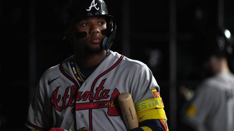 Aug 25, 2023; San Francisco, California, USA; Atlanta Braves right fielder Ronald Acuna Jr. (13) stands in the dugout during the fifth inning against the San Francisco Giants at Oracle Park. Mandatory Credit: Darren Yamashita-USA TODAY Sports