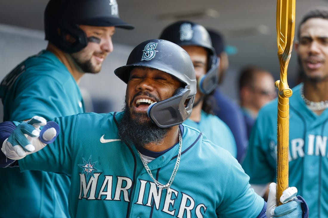 Mariners score 9 in 2nd inning, hold off Angels 11-8