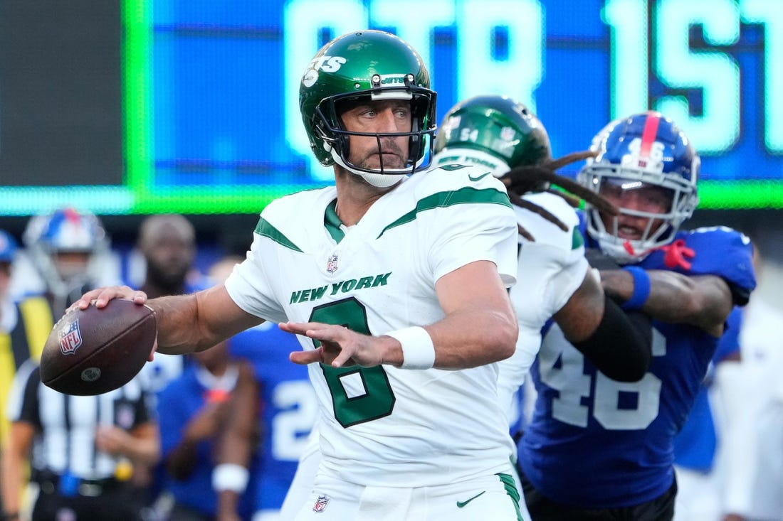 Aug 26, 2023; East Rutherford, New Jersey, USA;   New York Jets quarterback Aaron Rodgers (8) throws against the Giants at MetLife Stadium. Mandatory Credit: Robert Deutsch-USA TODAY Sports