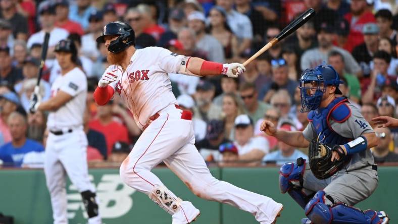 Aug 26, 2023; Boston, Massachusetts, USA;  Boston Red Sox first baseman Justin Turner (2) hits an RBI single against the Los Angeles Dodgers during the seventh inning at Fenway Park. Mandatory Credit: Bob DeChiara-USA TODAY Sports