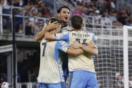 Aug 26, 2023; Washington, District of Columbia, USA; Philadelphia Union forward Mikael Uhre (7) celebrates with teammates after scoring a goal past D.C. United goalkeeper Tyler Miller (not pictured) during the first half at Audi Field. Mandatory Credit: Amber Searls-USA TODAY Sports