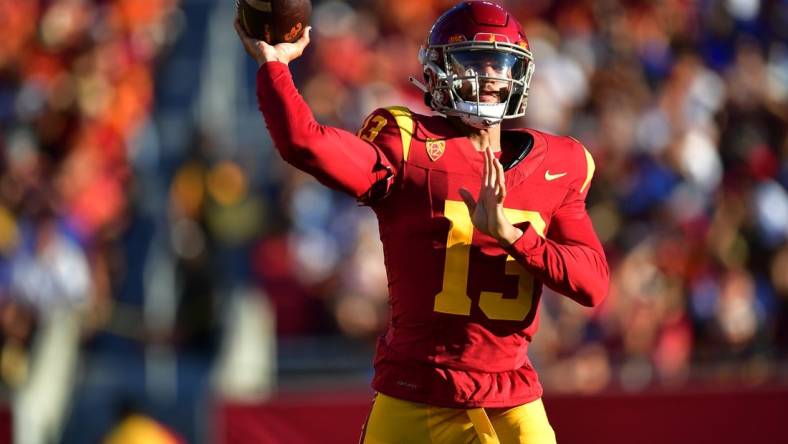 Aug 26, 2023; Los Angeles, California, USA; Southern California Trojans quarterback Caleb Williams (13) throws against the San Jose State Spartans during the first half at Los Angeles Memorial Coliseum. Mandatory Credit: Gary A. Vasquez-USA TODAY Sports