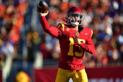 Aug 26, 2023; Los Angeles, California, USA; Southern California Trojans quarterback Caleb Williams (13) throws against the San Jose State Spartans during the first half at Los Angeles Memorial Coliseum. Mandatory Credit: Gary A. Vasquez-USA TODAY Sports